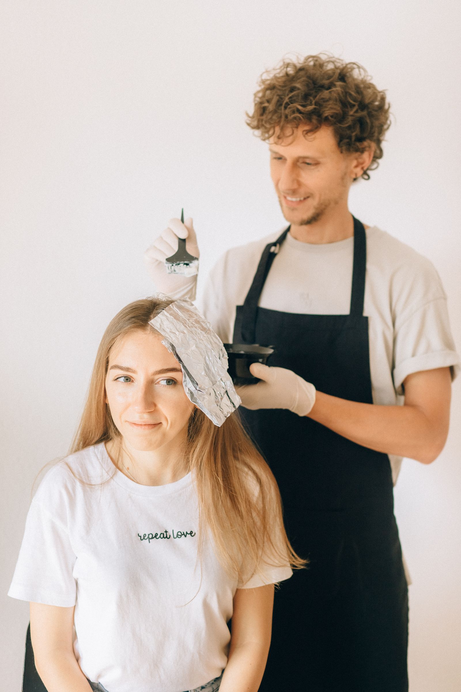 A colourist applying foils for a client at an English-speaking hair salon in Gangnam, Seoul